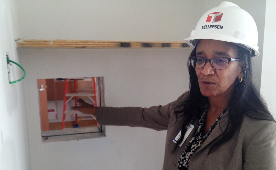 The biocontainment unit is still under construction. Dr. Judith Campbell, a specialist in pediatric infectious disease, explains that a "pass-through window" will allow health workers to make some deliveries without having to don and doff the entire protective outfit.