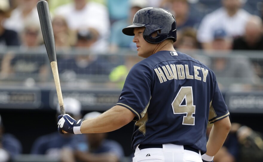 San Diego Padres' Nick Hundley looks back toward the mound at Seattle Mariners' James Paxton after striking out in the second inning of an exhibition baseball game on Friday, Feb. 28, 2014, in Peoria, Ariz. 