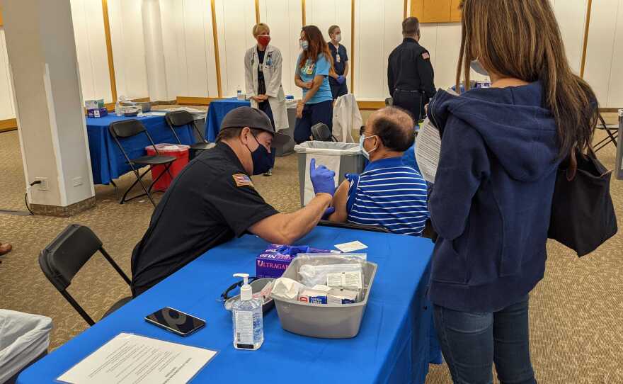 A man receives a COVID-19 vaccine at San Diego County's "Vaccination Superstation" in Chula Vista, Calif. Jan. 21, 2021.