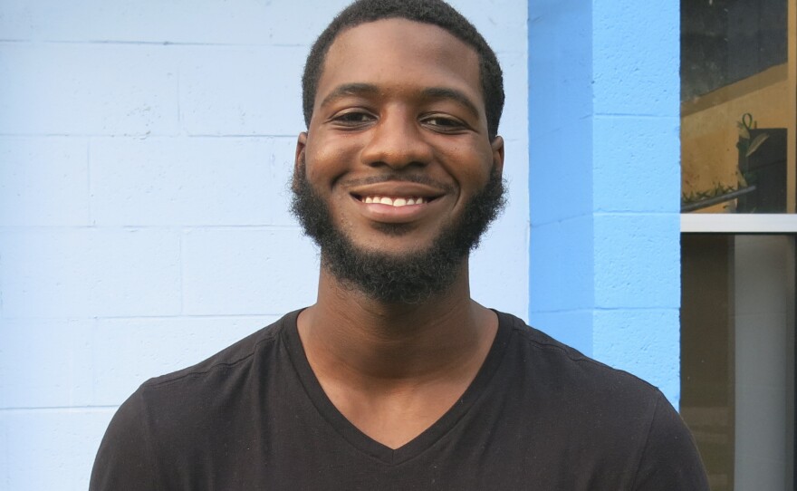 Randall Lofton, 20, is trying to balance a full time job and three classes at Valencia College.