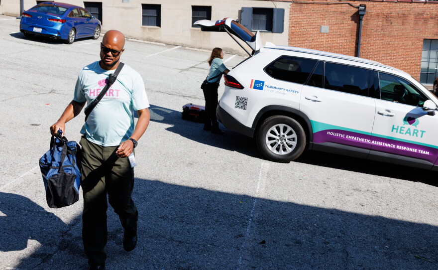 Rob Crisp, a peer support specialist with the Holistic Empathetic Assistance Response Team (HEART) program, responds to a call for a wellness check at a parking lot in Durham, N.C., on Sept. 14.