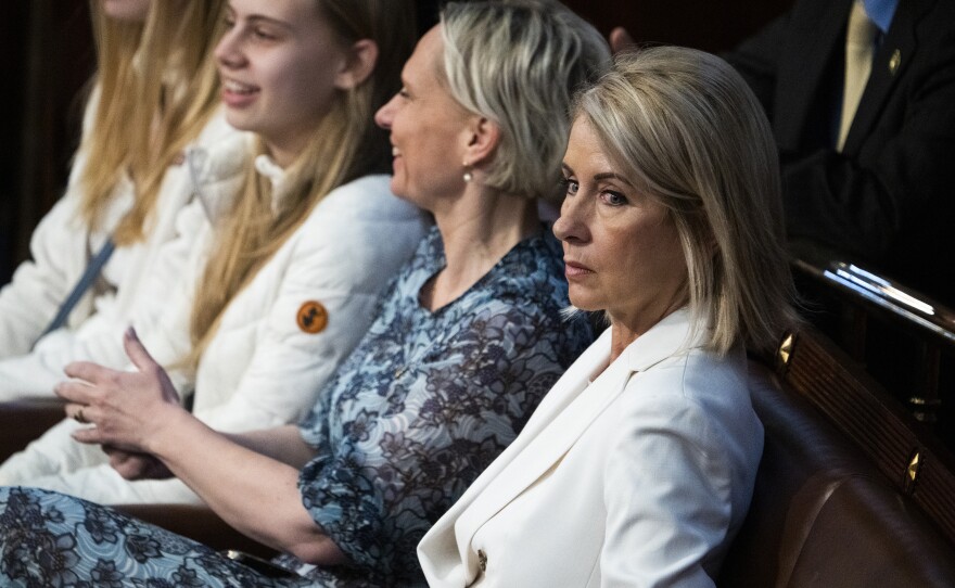 Reps. Mary Miller, R-Ill., right, and Victoria Spartz, R-Ind., are seen on the House floor.