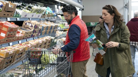 Rich Henderson and his wife, Rachel Negro-Henderson, grocery shop for their family at the Aldi in Bellmawr, New Jersey.
