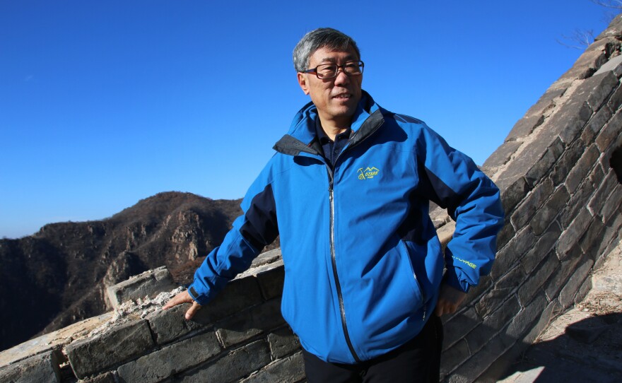 Dong Yaohui, vice chairman of the China Great Wall Society, walks on a relatively intact section of the wall near its eastern end. Dong was among three men who, in the 1980s, were the first Chinese known to have walked the wall's entire length from east to west.