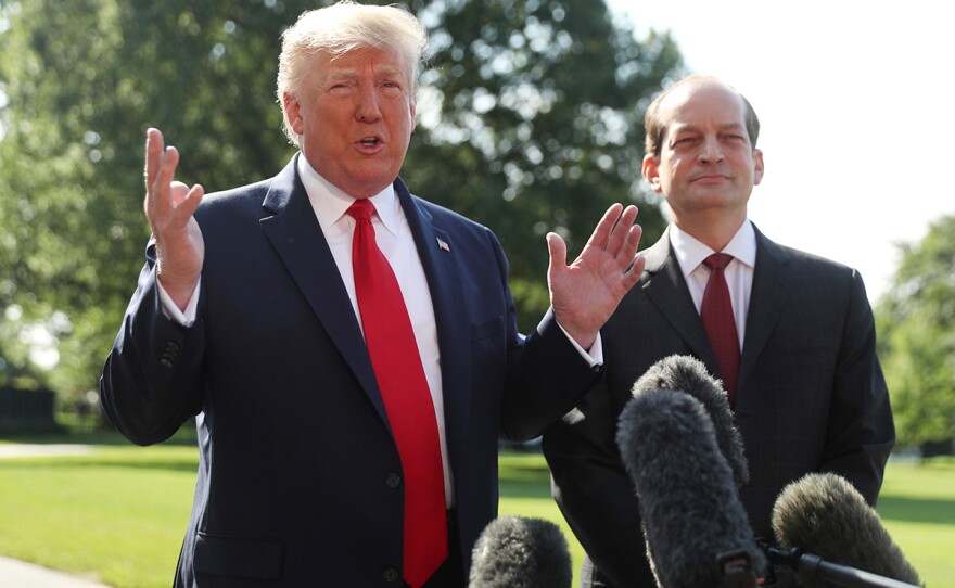 President Donald Trump speaks to members of the media with Secretary of Labor Alex Acosta on the South Lawn of the White House, Friday, July 12, 2019, before Trump boards Marine One for a short trip to Andrews Air Force Base, Md. and then on to Wisconsin.
