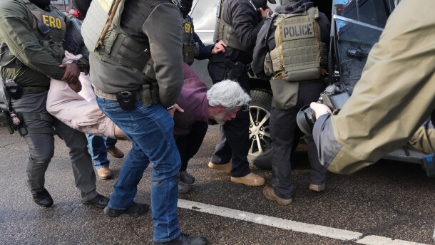 Protesters are arrested by federal agents near the scene where Renee Macklin Good was fatally shot by an ICE officer last January in Minneapolis.