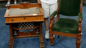 At the "Antiques Roadshow" event in Spokane, Washington, this owner proudly displays an heirloom desk and chair used at the United States House of Representatives from 1857 to 1873. Rarely found together — with the desks being far scarcer than the chairs — the matched pair prompts appraiser Brian Witherell of Witherell's to estimate the set's combined value at $40,000.
