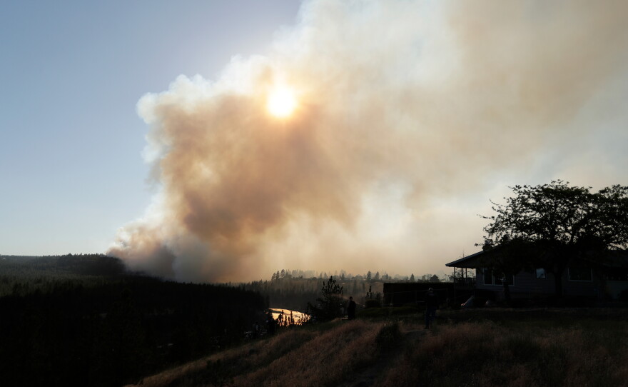 The Old Trails Fire is seen from W. Northwest Blvd., on Aug. 1, 2026, in Spokane, Wash.