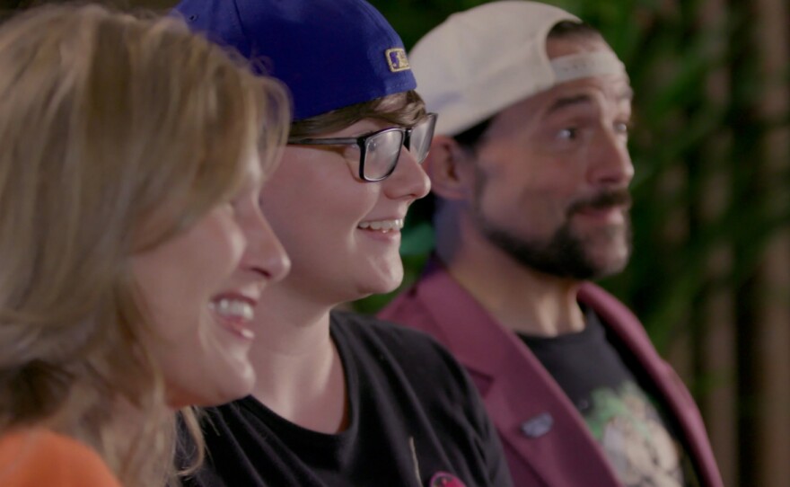 Filmmaker Sav Rodgers flanked by actress Joey Lauren Adams (left) and director Kevin Smith (right) in Rodgers' documentary "Chasing Chasing Amy."