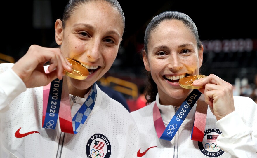 Diana Taurasi (left) and Sue Bird of the U.S. women's basketball team pose with their gold medals during the Tokyo Olympic Games in 2021. The two are tied for the most gold medals in Olympic basketball, for both the women's and men's competitions.