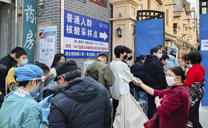 People line up for coronavirus tests outside a hospital in Shanghai on Friday.
