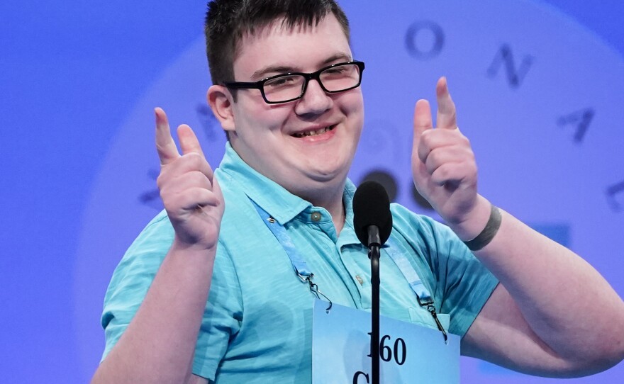 Chris Dominick, 14, from Struthers, Ohio, reacts after answering correctly to advance to the next round during the Scripps National Spelling Bee, on Tuesday in Oxon Hill, Md.