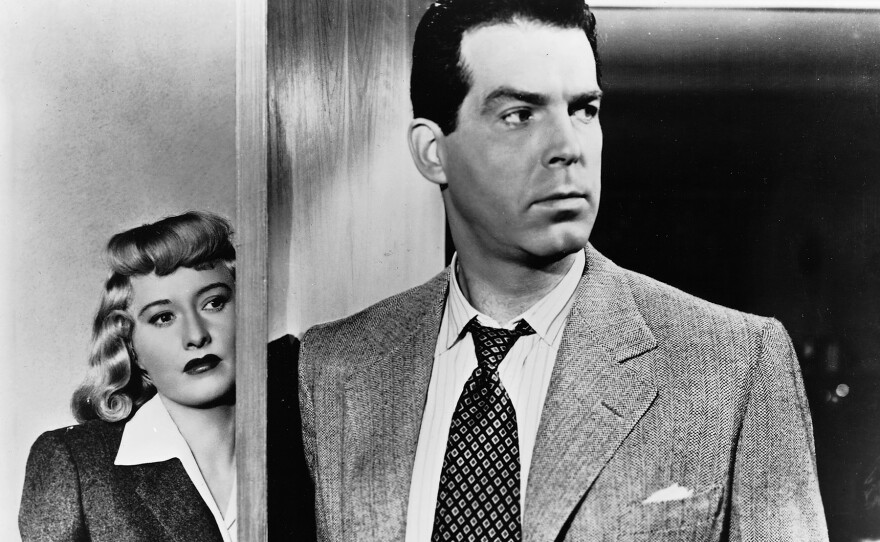 This classic scene of Phyllis Detrichson (Barbara Stanwyck) and Walter Neff (Fred MacMurray) was not in James M. Cain's novel but was one of the additions made by screenwriters Billy Wilder and Raymond Chandler for the film version of "Double Indemnity."