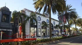 Rodeo Drive has less cars and pedestrians doing holiday shopping this year due to the coronavirus pandemic, in this photo taken Thursday, Dec. 3, 2020, in Beverly Hills, Calif.