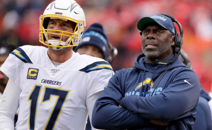 In this Sunday, Dec. 29, 2019 file photo, Los Angeles Chargers head coach Anthony Lynn stands next to quarterback Philip Rivers (17) during the second half of an NFL football game against the Kansas City Chiefs in Kansas City, Mo.