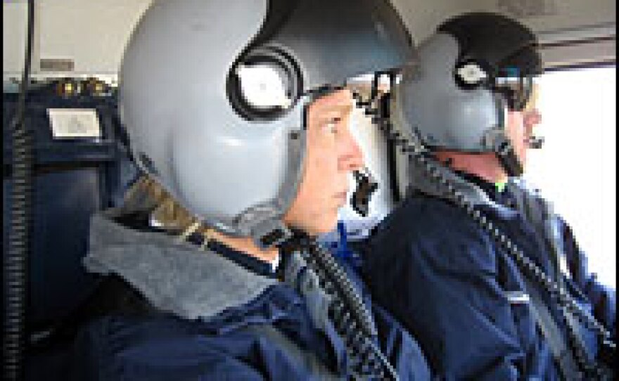 Nurse Rhonda Bailey (left) and flight paramedic Stacy Johnson watch for other aircraft and obstacles on a recent training flight. They work for Air Methods Huntsville MedFlight.