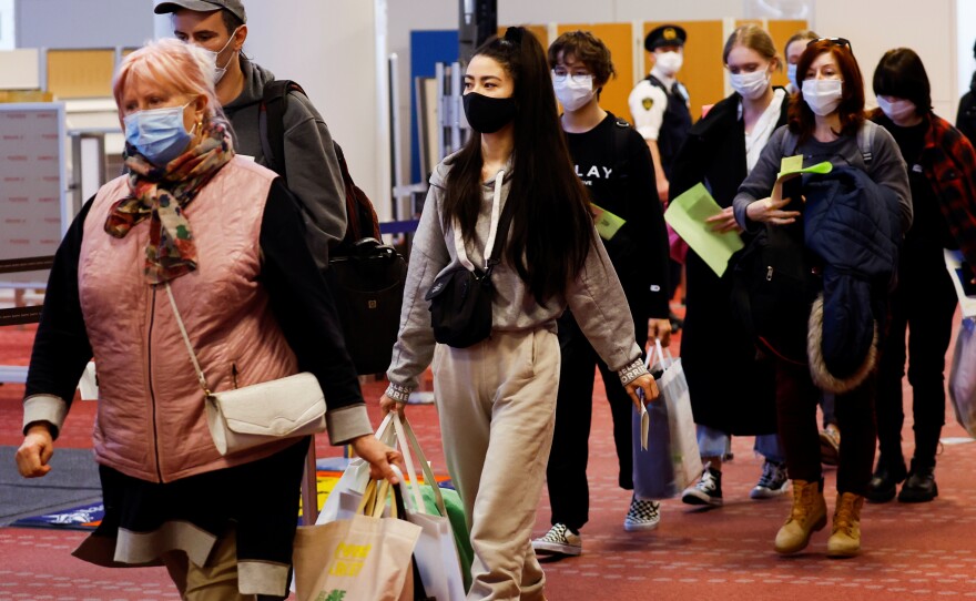 Ukrainian refugees arrive at Haneda airport in Tokyo on April 5.