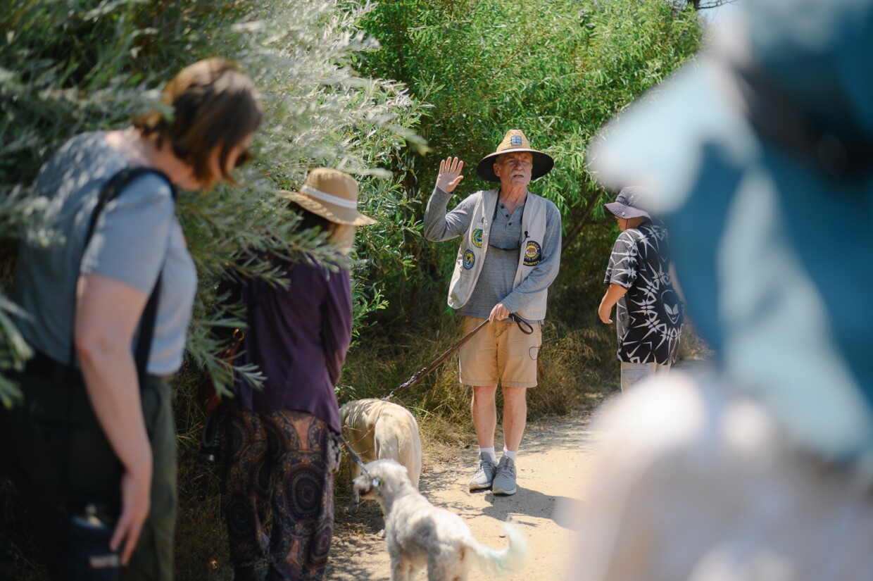 Volunteer docent Ron Peterson leads his tour, “An Eye-Opening Experience Without Sight,” through the Tijuana River Estuary in Imperial Beach, California on August 3, 2024. Peterson lost his sight to glaucoma four years ago and has begun leading a tour of the estuary guided by the other senses.