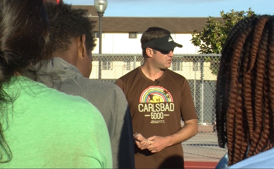 City Heights Runners co-founder and coach of Hoover High School's track and field and cross country teams, Chris Brewster, speaks to a group of students at practice, Feb. 21, 2017.