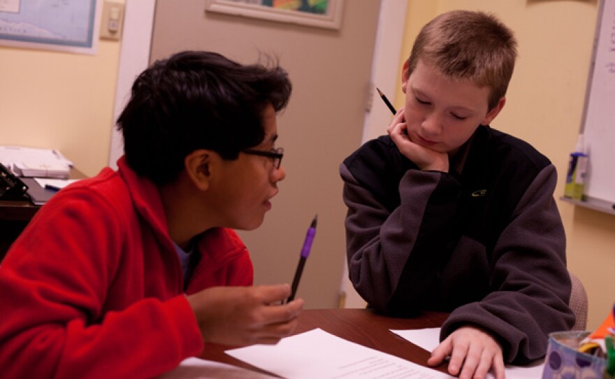 Cooper and Ned in Marilyn Bookwalter's tutorial class helping each other out on a question.