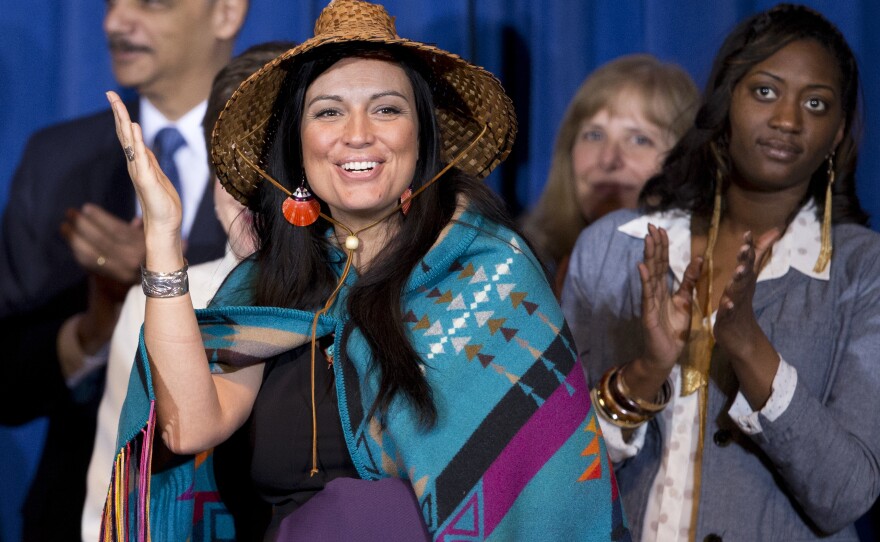 Deborah Parker, vice chair of the Tulalip Tribes of Washington state, reacts to President Barack Obama signing the Violence Against Women Act in 2013 in Washington.