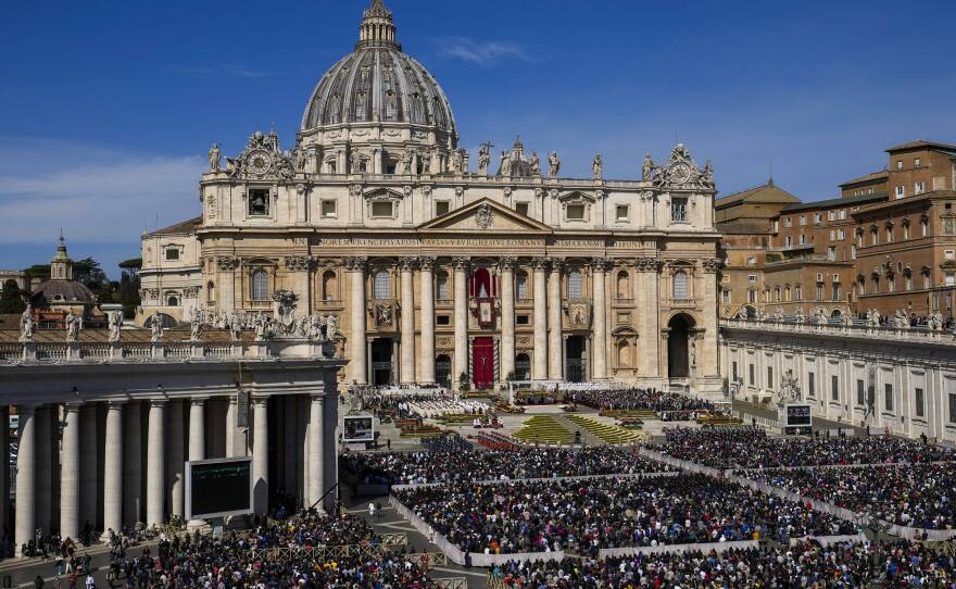 Faithful gather to attend the Catholic Easter Sunday mass led by Pope Francis in St. Peter's Square at the Vatican, Sunday, April 17, 2022.
