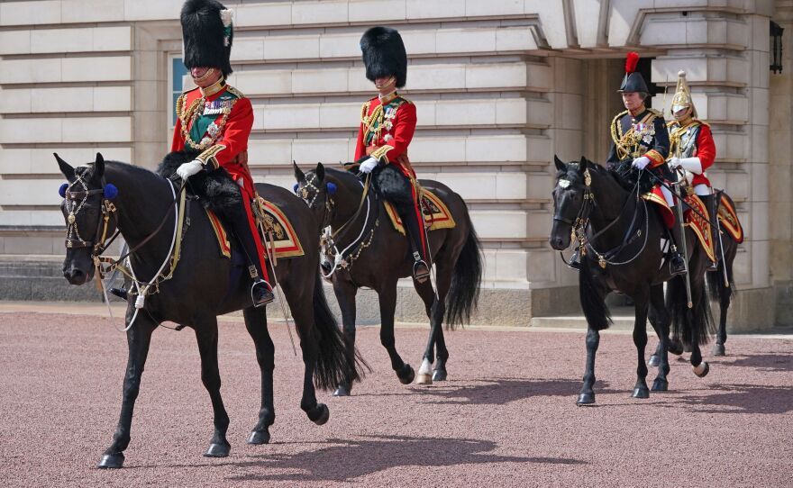 Britain's Prince Charles (left), Prince William (center) and Princess Anne (second from right) leave Buckingham Palace on their way to the queen's birthday parade.