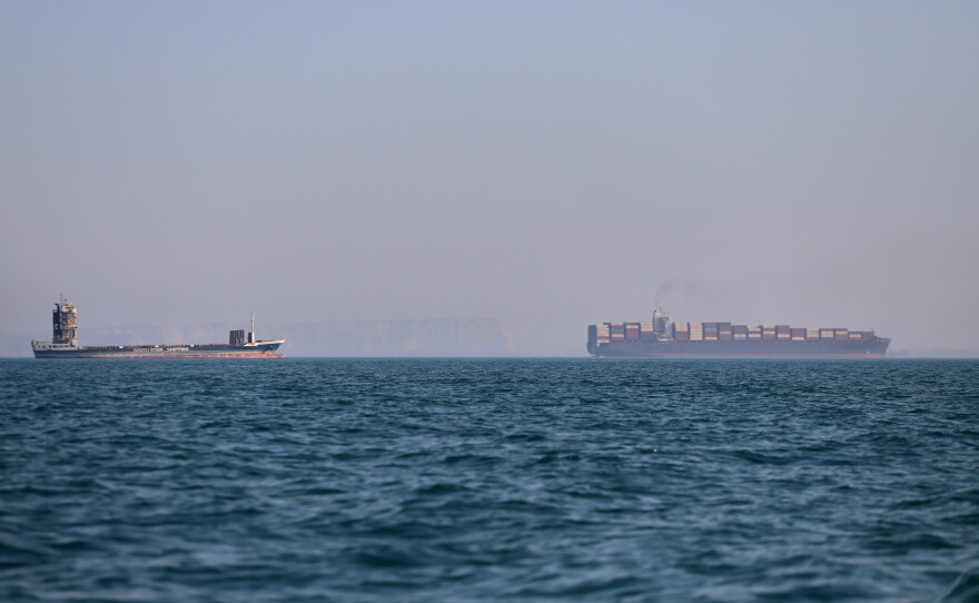 A container ship and a cargo vessel are seen in the Strait of Hormuz off Bandar Abbas, Iran, on June 17.