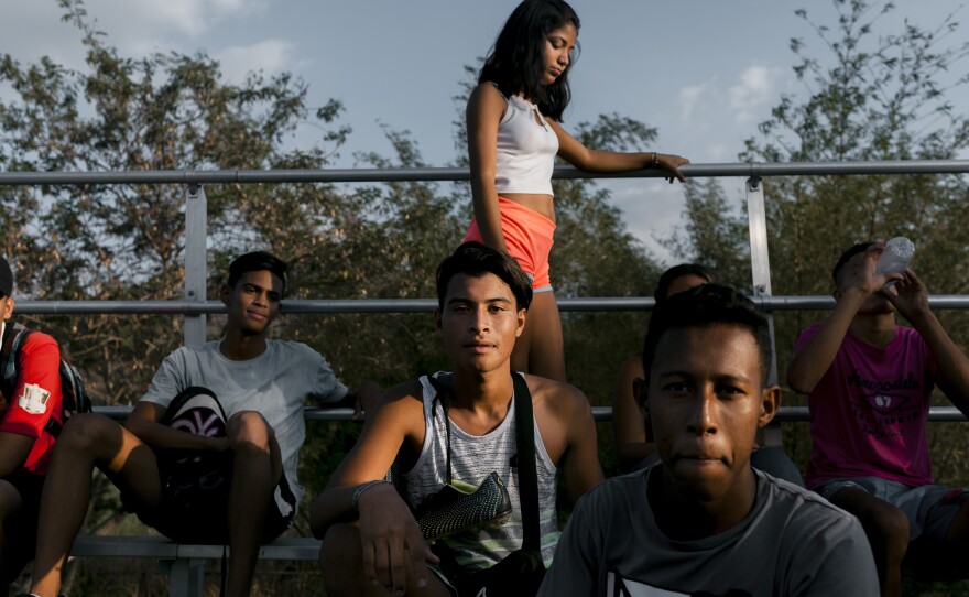 Alcatraz team members take a rest in the stands after practice.