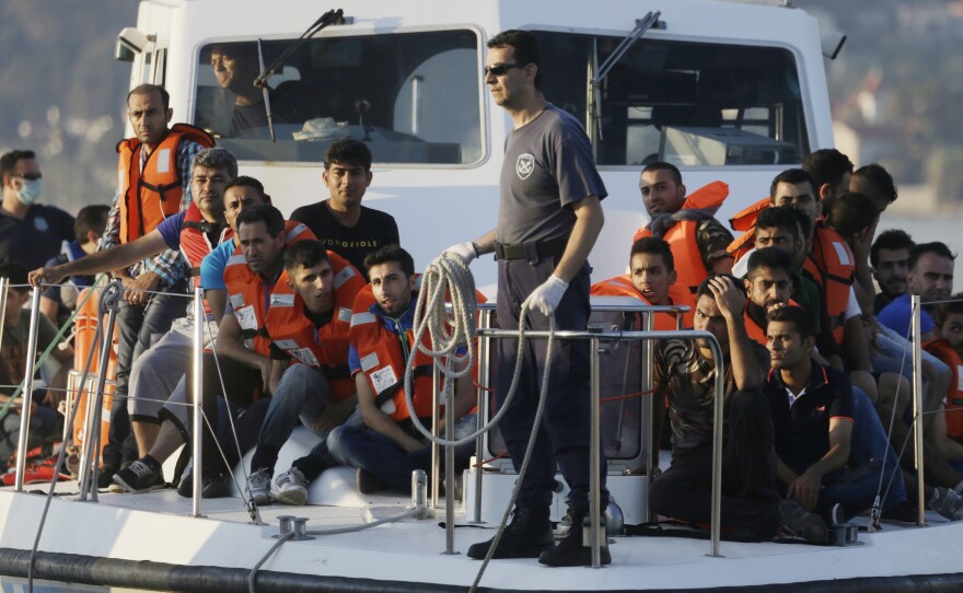 NATO on Thursday ordered a naval force to move immediately to the Aegean Sea to help end the deadly smuggling of migrants between Turkey and Greece. In this photo from last June, a Greek coast guard vessel arrives carrying migrants at the port of Mytilene, Greece, after a rescue operation.