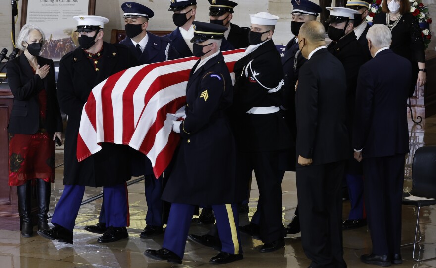 A U.S. Joint Forces bearer team carries the casket of former Senate Majority Leader Harry Reid into the Rotunda of the Capitol.