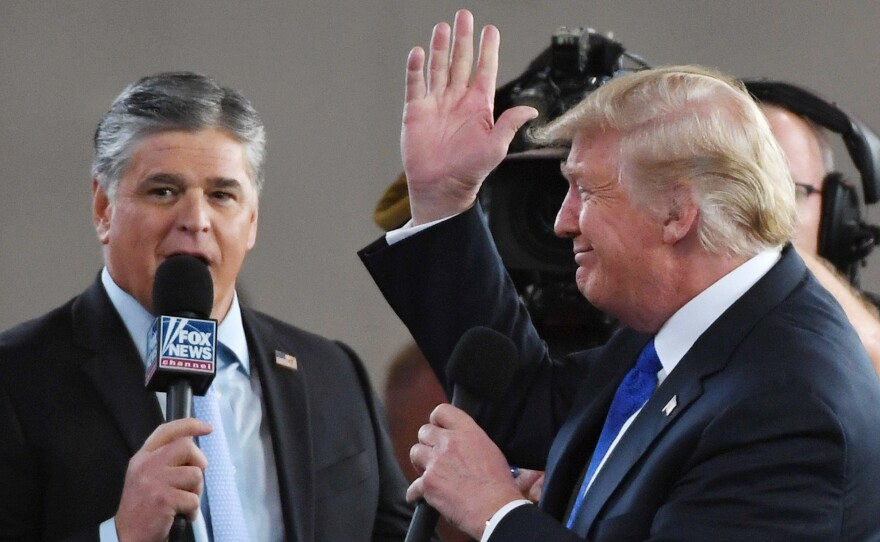 Fox News Channel and radio talk show host Sean Hannity interviews President Trump in Las Vegas in 2018. Hannity, like Trump, has cast doubt on the 2020 election results without providing evidence.