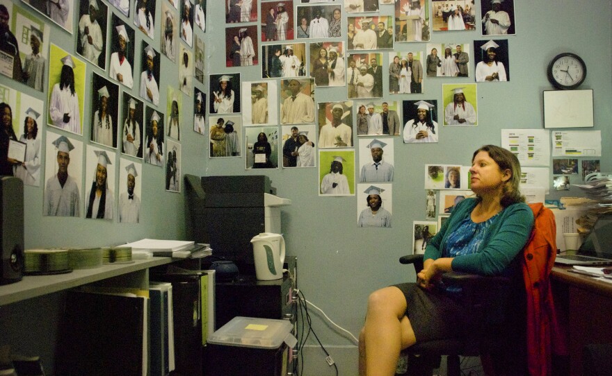 Elizabeth Ostberg, founding principal of The NET, has decorated her office with photos of students who have graduated.