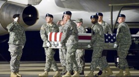 A U.S. Army carry team transfers the remains of Army Sgt. Enrique Mondragon, of The Colony, Texas, at Dover Air Force Base, Del., Dec. 25, 2012.
