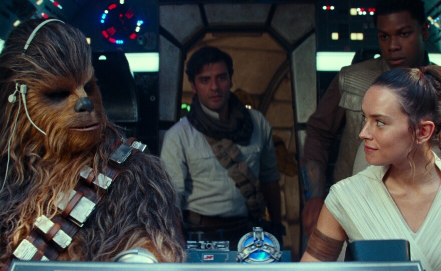 Chewbacca (Joonas Suotamo), Poe (Oscar Isaac), Rey (Daisy Ridley) and Finn (John Boyega) take on the enemy one last time in Star Wars: The Rise of Skywalker.