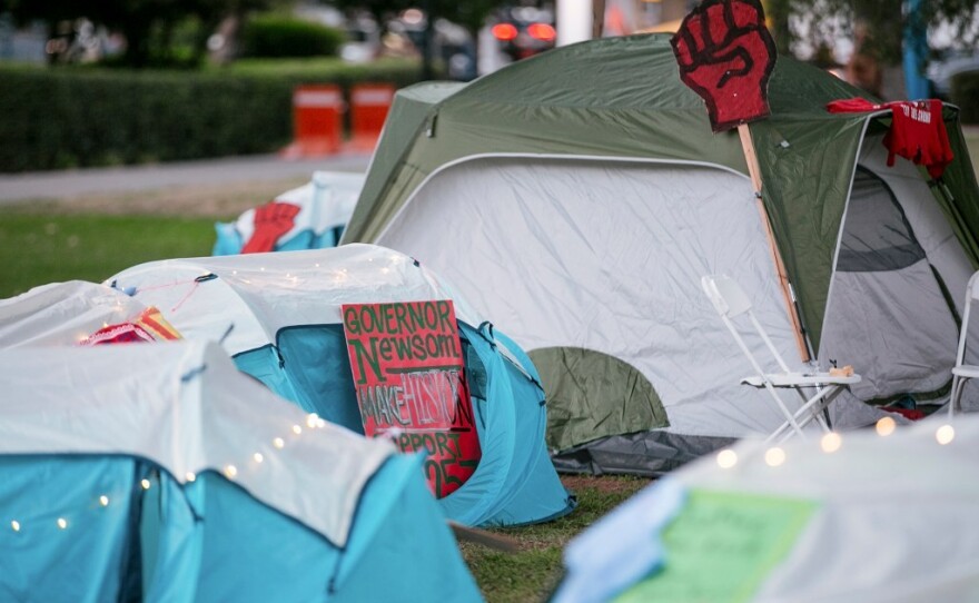 AB 257 supporters set up a camp to raise awareness of the legislation at the state Capitol in Sacramento on Aug. 16, 2022.