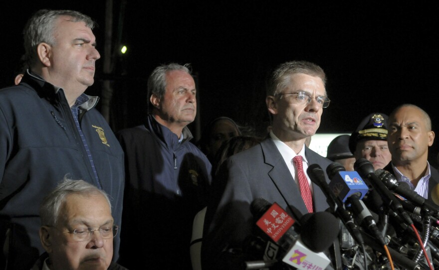 FBI Special Agent in Charge Richard DesLauriers (at the microphones), Boston Police Commissioner Edward Davis (standing, at far left) and other authorities briefing the news media on April 19. That's the day Boston bombings suspect Tamerlan Tsarnaev was killed and his brother, Dzhokhar, was captured.