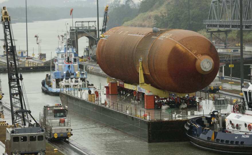 A tugboat and barge transporting NASA's only remaining space shuttle external tank makes it through the Miraflores locks in the Panama Canal in April. The tank was headed to the California Science Center in Los Angeles as part of the Space Shuttle Endeavour display.