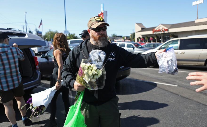 Founder Duke Aaron greets members of the Puget Sound John Brown Gun Club. In 2017, van Spronsen was the club's first recruit.