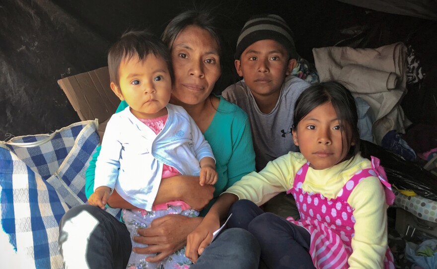 Rosia Ramirez Penaloza and her children fled gang violence in southern Mexico. They're staying in a makeshift tent in San Luis Río Colorado as they wait for a chance to apply for asylum at the port of entry.