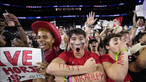 San Diego State fans cheer before during the first half of the men's national championship college basketball game against Connecticut in the NCAA Tournament on Monday, April 3, 2023, in Houston.