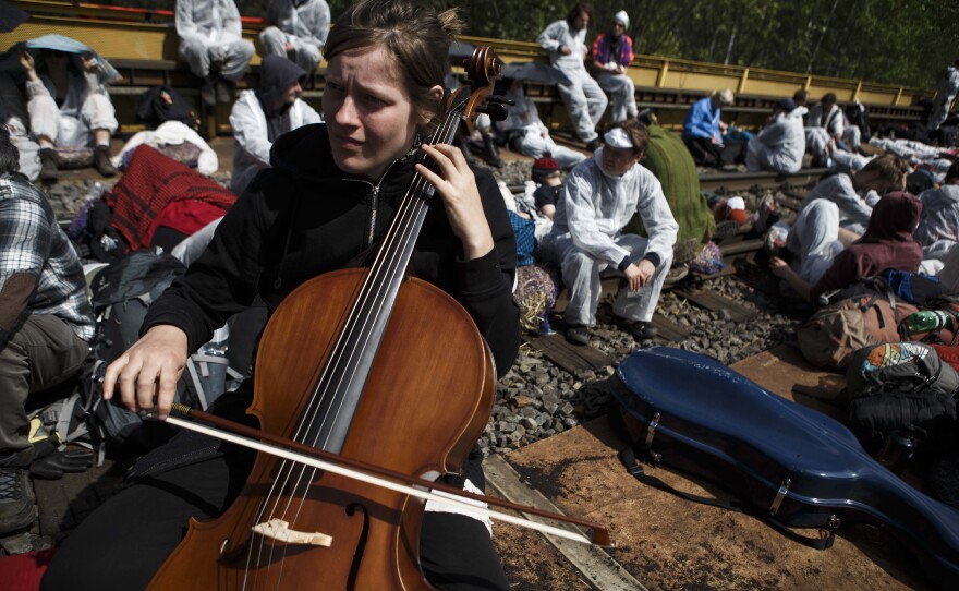 A cellist plays as anti-coal mine activists attempt a railway blockade near Spremberg, Germany, on Saturday.