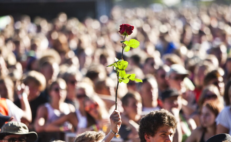 Fans pay their respect as Patti Smith performs in Roskilde, Denmark on July 1, 2010 in memory of the nine people who died during a Pearl Jam concert at the 2000 Roskilde Festival.