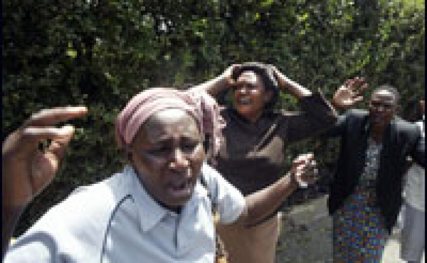 Family members and friends of Melitus Mugabe Were, a member of parliament representing Raila Odinga's Orange Democratic Movement, mourn his death on Tuesday.