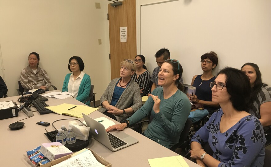 Jennifer Burney, PhD, (center), an environmental scientist with UC San Diego, shares her latest Kawasaki disease climate research with a group of doctors, scientists, molecular biologists and geneticists with the Kawasaki Disease Research Center,  April 8, 2019.