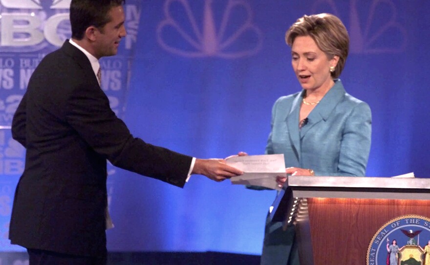 During a 2000 Senate debate, Hillary Clinton's opponent Rick Lazio, R-N.Y., hands her a pledge to stop taking "soft money." But Lazio's tone was criticized for how not to debate a female candidate.