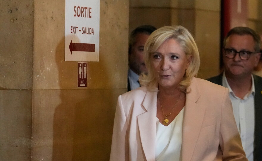 Far-right leader Marine Le Pen arrives at the courtroom for the verdict of her appeals trial, in Paris, France, Tuesday, July. 7, 2026.