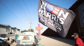 A Biden-Harris campaign flag flies at an encampment for farmworkers that has been set up in Calexico, March 18, 2021. 