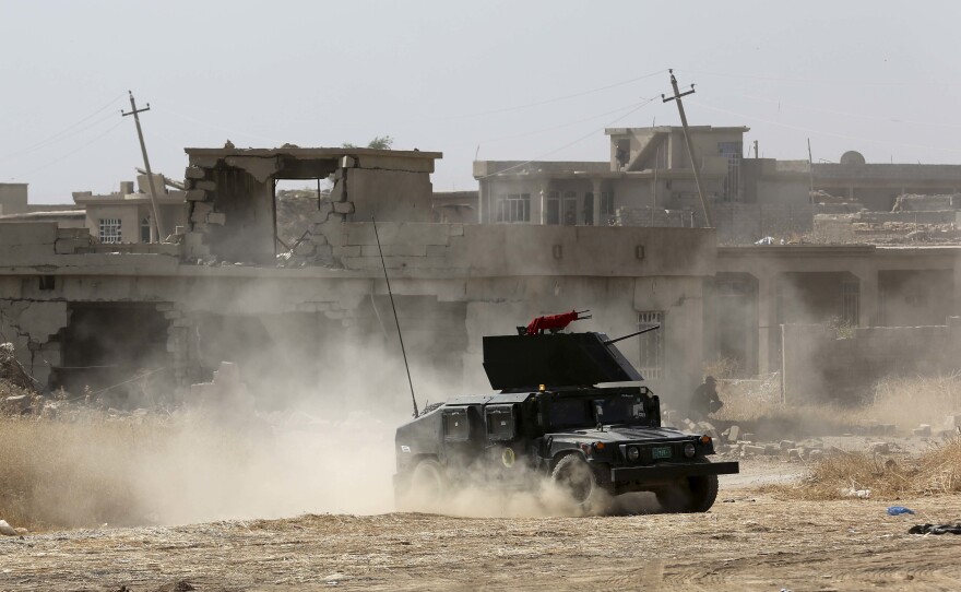 Iraqi forces are deployed outside Mosul, Iraq, on Monday, during an offensive to retake the city from Islamic State militants. Columns of Iraqi and Kurdish forces backed by U.S.-led airstrikes are slowly advancing on Mosul from several directions.