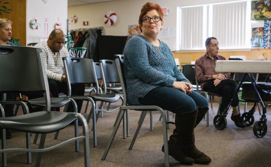 Pauline sits after practice for a Christmas show with fellow group members of a day program at the Arc Northeastern Pennsylvania. Pauline, who has intellectual disabilities, has been with the Arc program since 2014, after an emergency removal from her previous caretaker's home by Adult Protective Services when she was sexually assaulted.